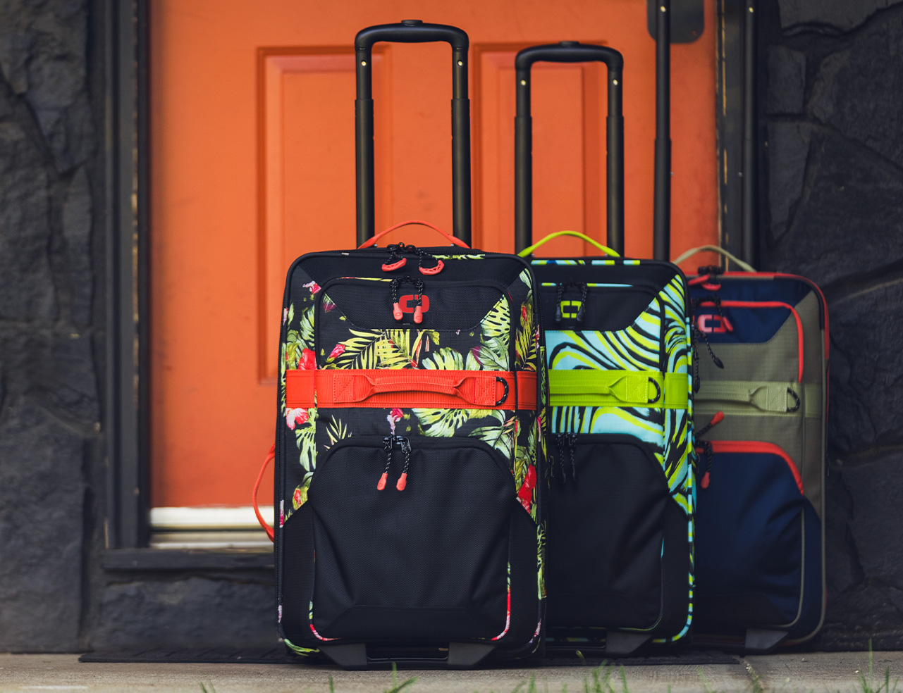 three rolling travel bags